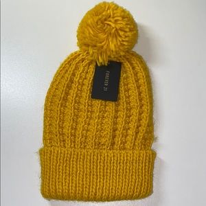 Yellow knit beanie with pom
